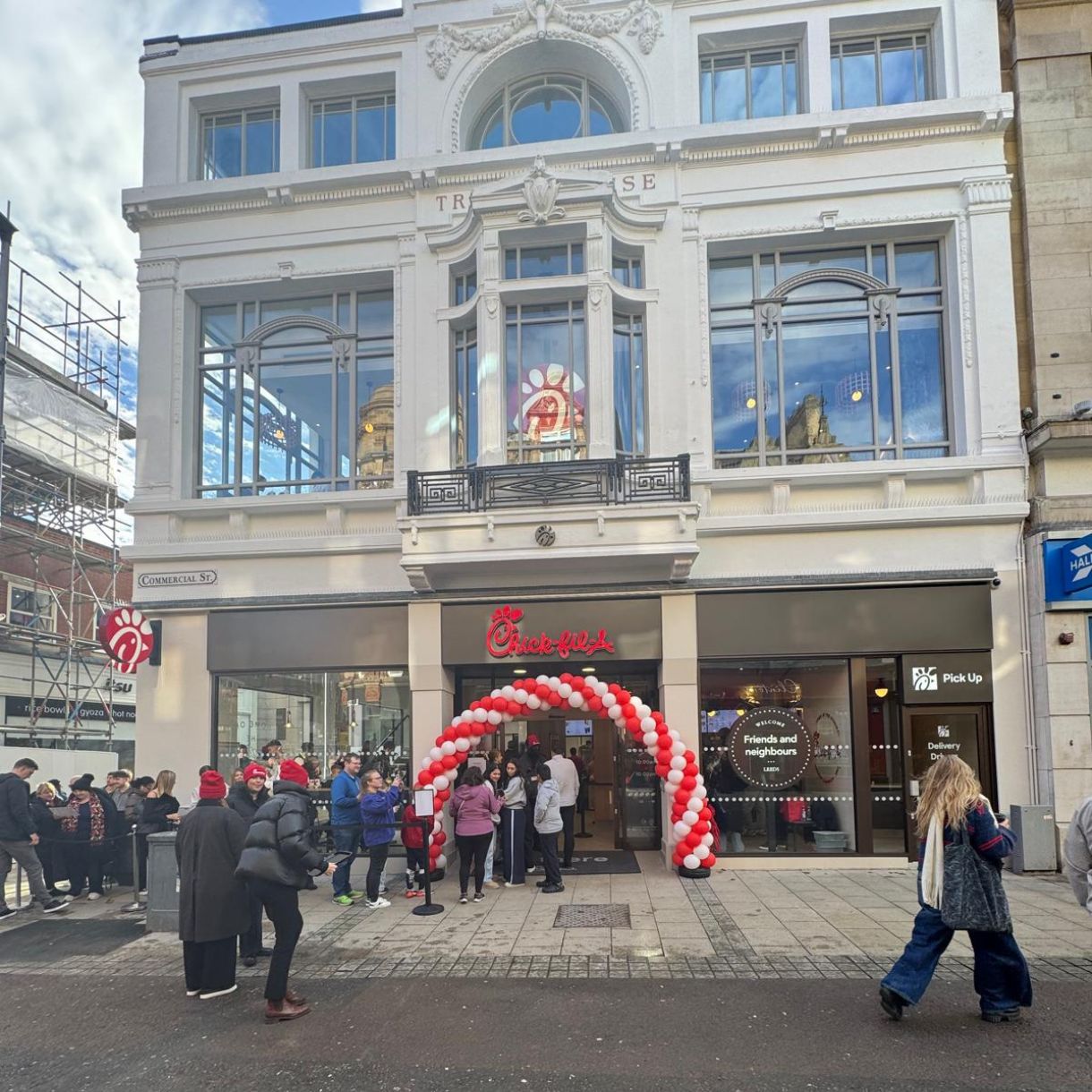 Excited customers queue outside the new Chick-fil-A Leeds as Professional Security staff manage the opening day crowd.