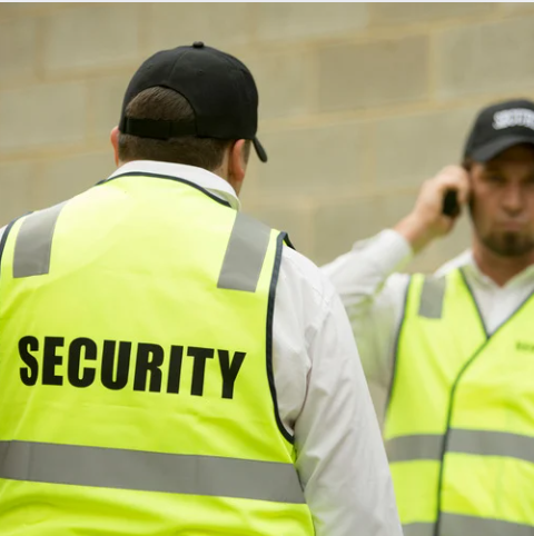 2 security guards in hi-vis and hats