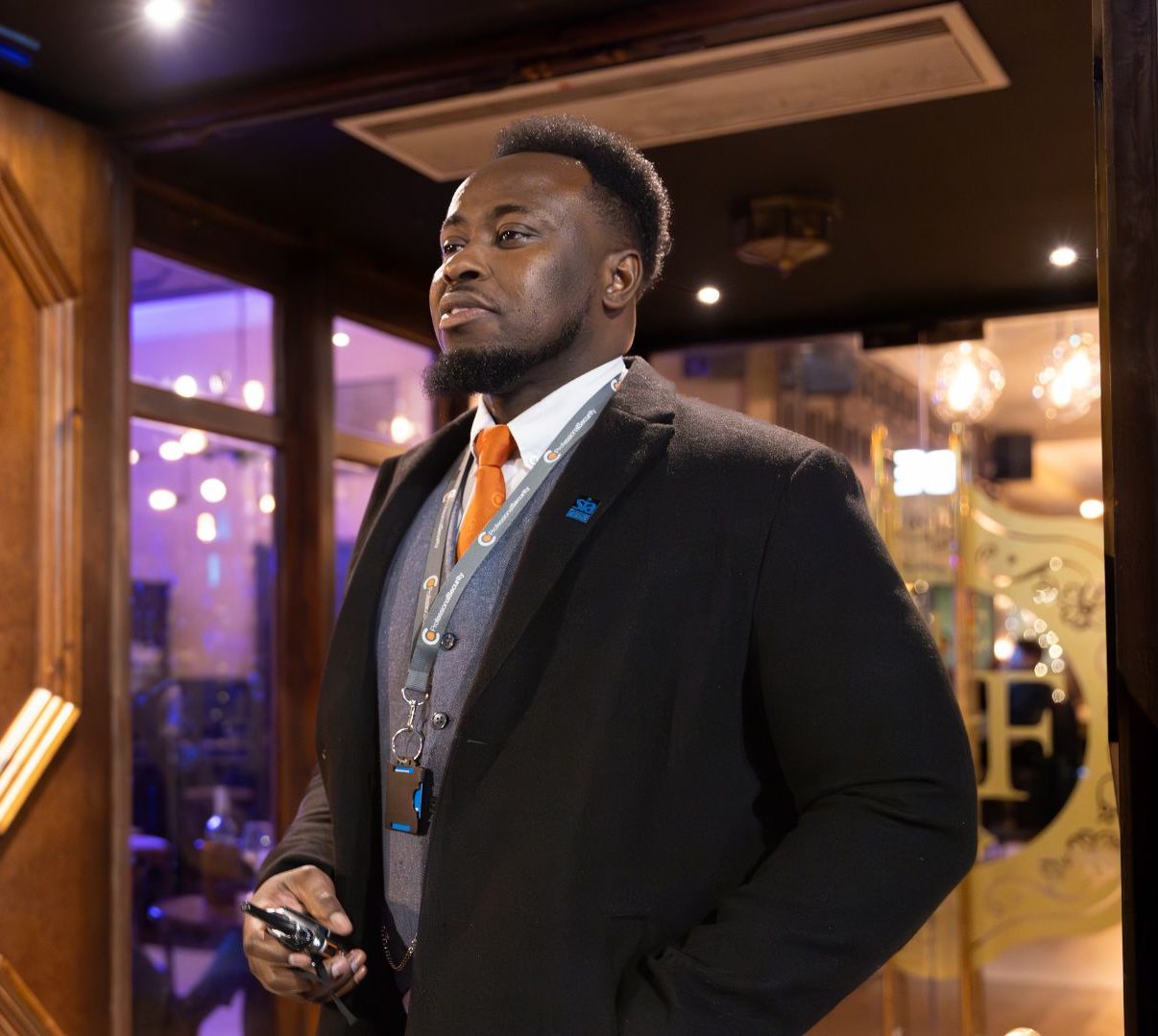 Member of staff stood on the door of a venue